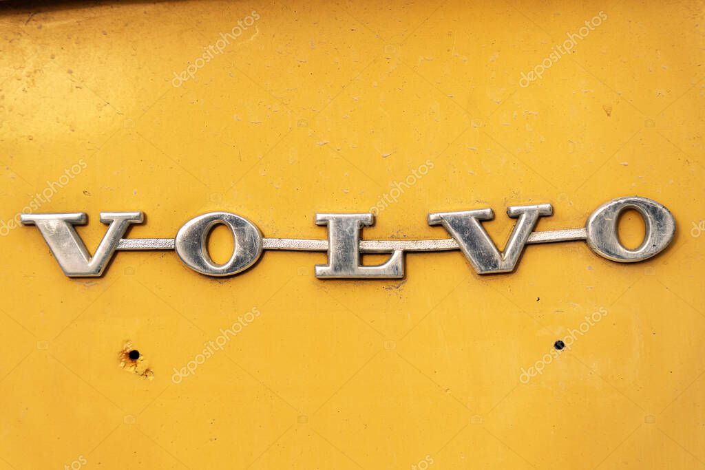 Rishon Lezion, Israel - May 15,2025. Old Volvo metallic logo badge on an orange car