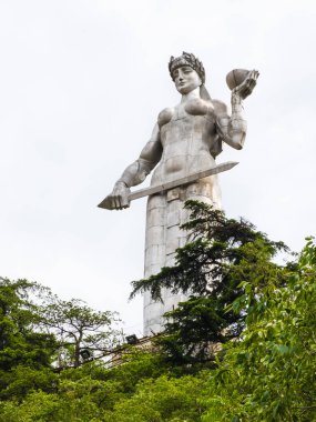 Mother Georgia or Kartlis Deda Monument in Tbilisi, Georgia. Statue with sword and bowl of wine is symbol for fight and hospitality. Memorial stands on Sololaki hill and overlooks old town of Tiflis.