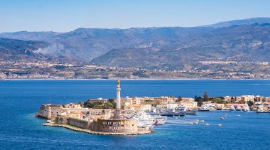 The Strait of Messina between Sicily and Italy. View from Messina town with golden statue of Madonna della Lettera and entrance to harbour. Calabria coastline in background. clipart