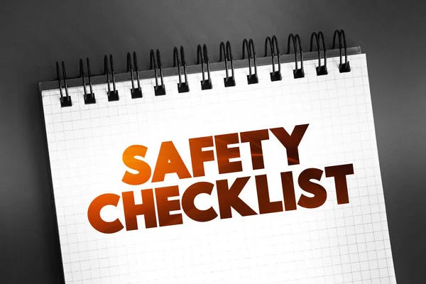 Safety Checklist text on notepad, concept background