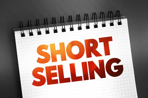 stock image Short Selling - sale of a stock you do not own, text concept on notepad