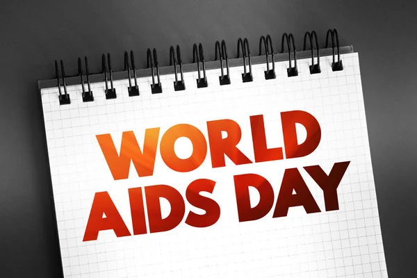 World Aids Day - international day dedicated to raising awareness of the AIDS pandemic caused by the spread of HIV infection, text on notepad concept background