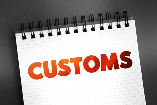 Customs - authority or agency in a country responsible for collecting tariffs and for controlling the flow of goods, text on notepad concept for presentations and reports