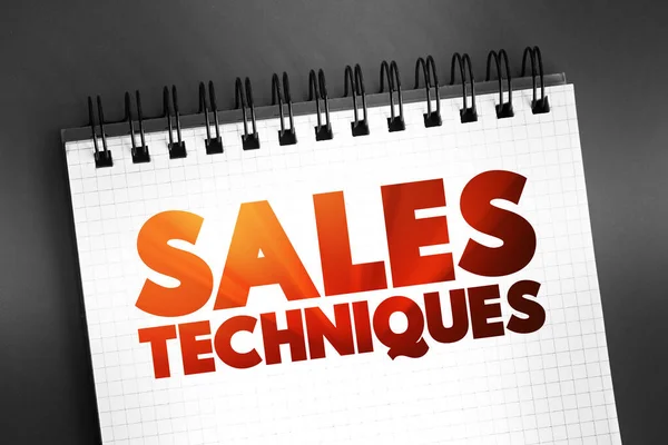 Sales Techniques text quote on notepad, concept background
