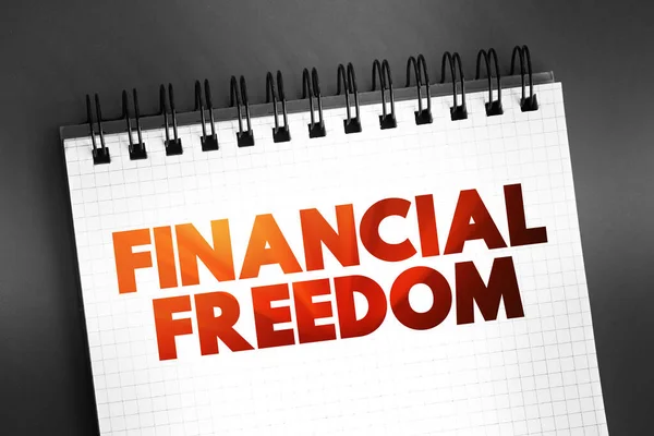 Financial freedom - having enough savings, financial investments, and cash on hand to afford the kind of life we desire for our families, text on notepad, concept background