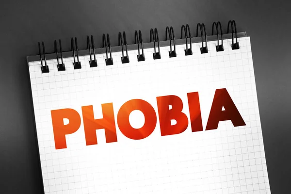 Phobia - anxiety disorder defined by a persistent and excessive fear of an object or situation, text on notepad, concept background