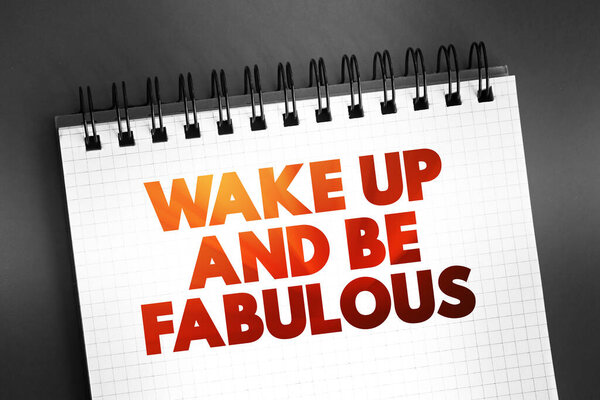 Wake up and be fabulous text quote on notepad, concept background