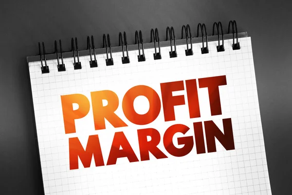 stock image Profit Margin - measure of profitability, calculated by finding the net profit as a percentage of the revenue, text on notepad