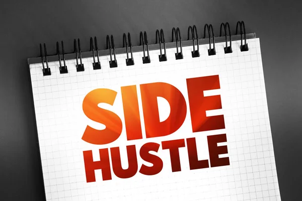 Side Hustle - additional job that a person takes in addition to their primary job, text concept on notepad