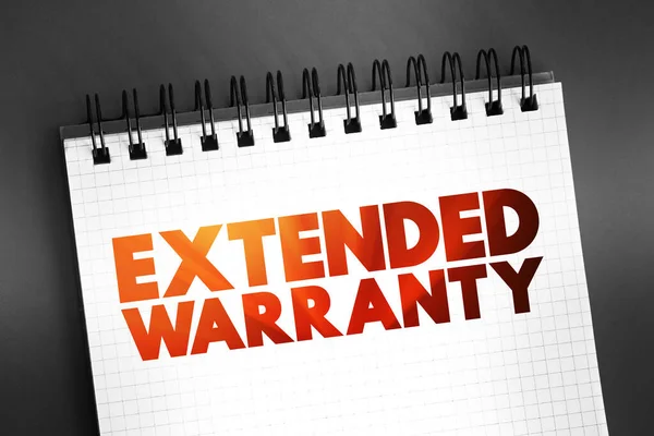 stock image Extended Warranty - policies that extend the warranty period of consumer durable goods beyond what is offered by the manufacturer, text concept on notepad