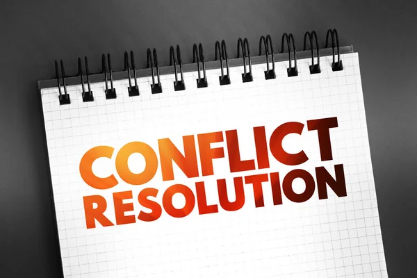 Conflict resolution - way for two or more parties to find a peaceful solution to a disagreement among them, text concept on notepad