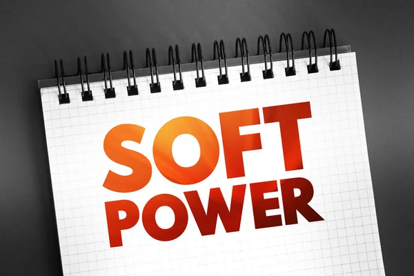 Soft power - ability to attract co-opt rather than coerce, text concept on notepad