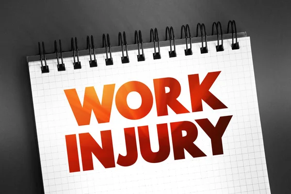 Work Injury - personal injury, disease or death resulting from an occupational accident, text concept on notepad
