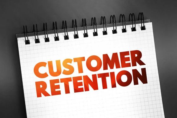 Customer Retention - ability of a company or product to retain its customers over some specified period, text on notepad, concept background
