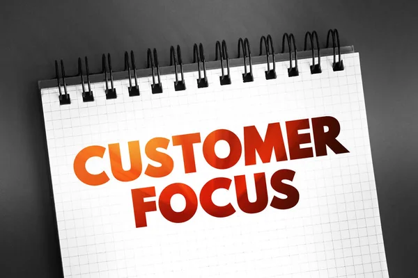 Customer Focus text on notepad, concept background