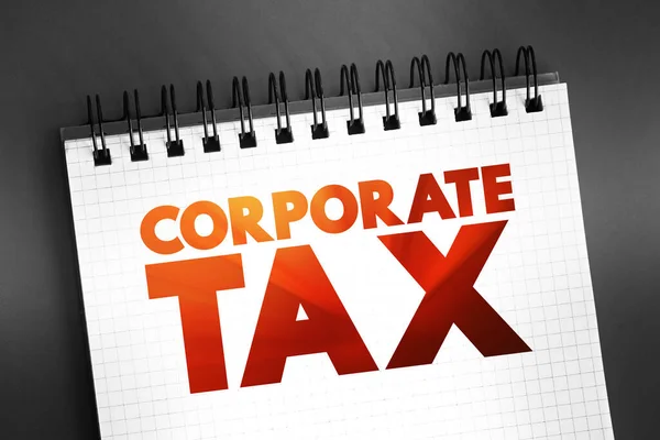 Corporate Tax - direct tax imposed on the income or capital of corporations or analogous legal entities, text on notepad, concept background