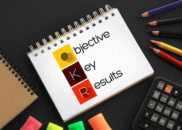 OKR - Objective Key Results acronym on notepad, business concept background