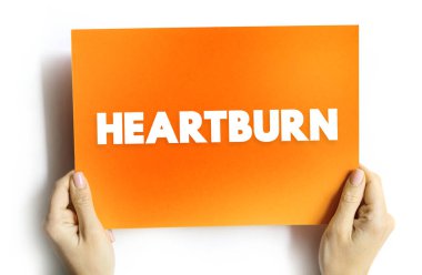 Heartburn is a burning feeling in the chest caused by stomach acid travelling up towards the throat, text concept on card clipart