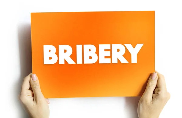 stock image Bribery is the offering, giving, receiving, or soliciting of any item of value to influence the actions of an official, text concept on card