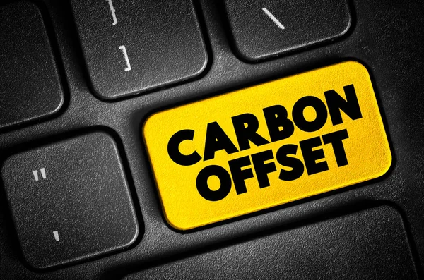 Carbon offset - reduction of emissions of carbon dioxide made in order to compensate for emissions made elsewhere, text button on keyboard