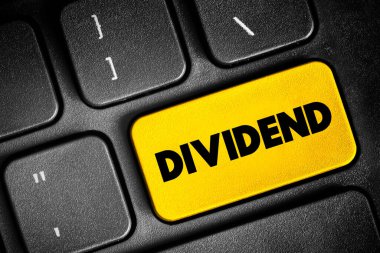 Dividend - distribution of profits by a corporation to its shareholders, text concept button on keyboard