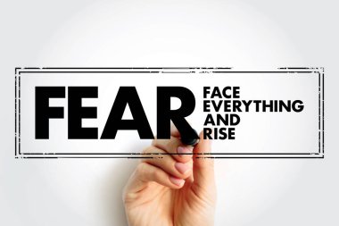 FEAR - Face Everything And Rise acronym text stamp, concept background
