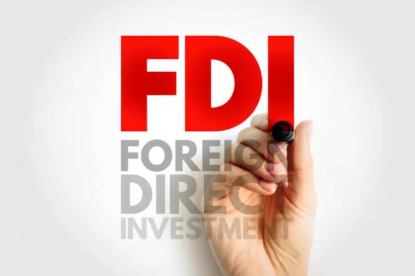 FDI Foreign Direct Investment is an investment in the form of a controlling ownership in a business in one country by an entity based in another country, acronym text concept background