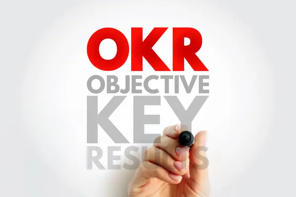 OKR Objective Key Results - goal setting framework used by individuals, teams, and organizations to define measurable goals and track their outcomes, acronym text concept background
