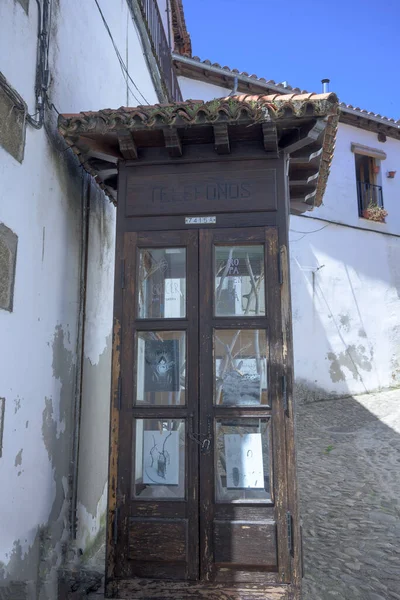 Recycled wooden phone booth in old town in Hervas