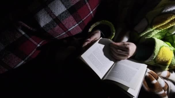 Woman Reads Book Lying Sofa Night Light Flashlight Girl Dressing — Vídeo de stock