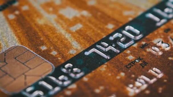 Golden Debit Card Rotates Close Credit Card Chip Numbers Plastic — Vídeo de Stock