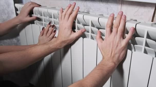 Frozen Male Female Hands Touch Home Radiator Try Warm Home — Stock videók