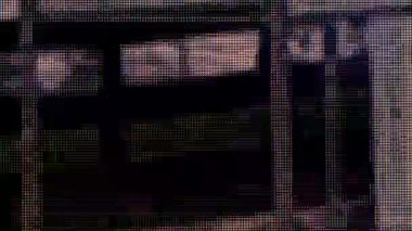 Macro view of a television LCD screen at the time of broadcasting a TV program. Close-up of the monitor pixels. Red, blue and green sub-pixels create an image on the screen. VA matrix of 4K TV.