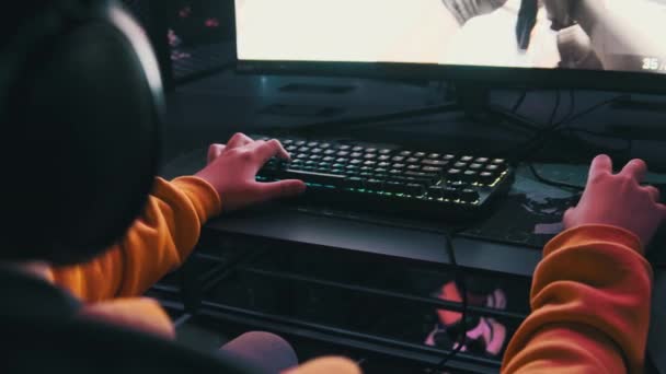 Boy Computer Club Sits Monitor Playing Shooter Game Gaming Chair — Stock Video