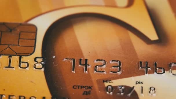 Debit Card Rotates Close Golden Credit Card Chip Numbers Plastic — Stockvideo