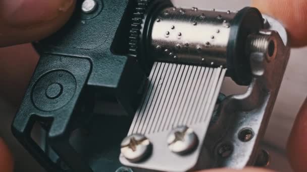 Old Music Box Mechanism Spinning Cylinder Cogs Male Hands Macro — Video
