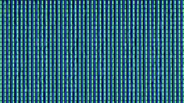 RGB Multi-Colored Sub Pixels of LED Matrix of the TV in Extreme Macro. Rows of colored RGB sub-pixels create an abstract pattern. Extreme macro Red, blue, and green LED pixels of VA matrix of 4K TV.