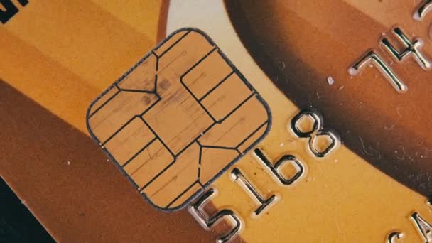 Golden Debit Card Rotates Close Credit Card Chip Numbers Plastic — Wideo stockowe