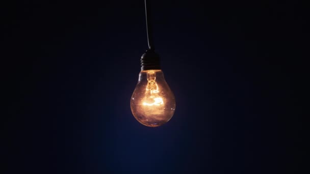 Incandescent Lamp Wire Glows Flickers Dark Blue Background Edison Bulb — Stok video