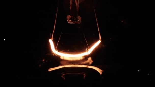 Incandescent Filament Close Glows Flickers Black Background Bulb Turns Warm — Stok Video