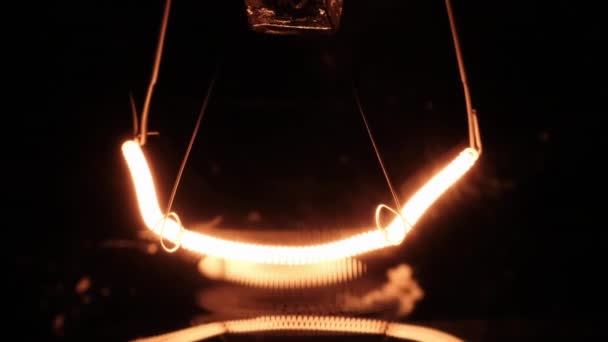 Tungsten Filament Incandescent Bulb Glows Flickers Close Black Background Lamp — Vídeos de Stock
