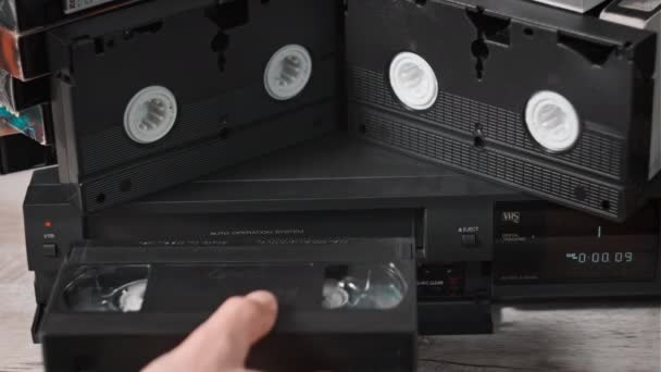 Male Hand Inserts Vhs Cassette Vcr Video Recorder Black Vintage — Vídeos de Stock