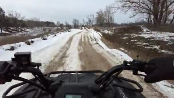 First Person View Man Riding Quad Bike Snowy Terrain Steering — Vídeos de Stock