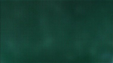Macro view of a television LED screen with RGB sub-pixels. Colored pixels in close-up create an abstract pattern. Red, blue, and green LCD pixels background of VA matrix of 4K TV. Closeup monitor.