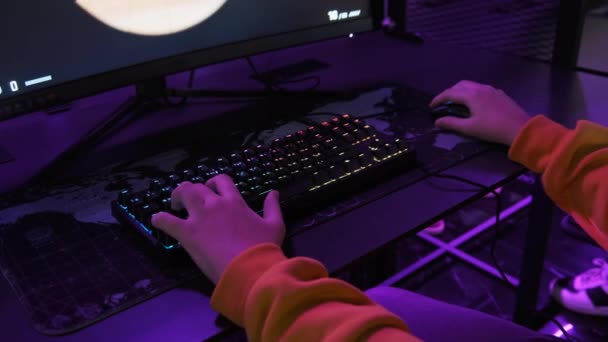 Teenage Boy Esports Club Sits Front Monitor Plays Shooter Game — Stock Video