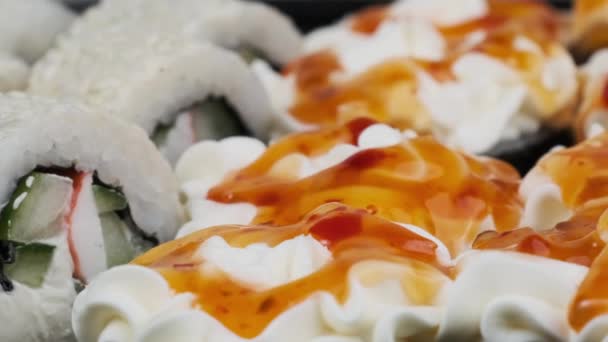 Japanese Sushi Rolls Plastic Box Rotating Close Takeaway Fresh Sushi — Video