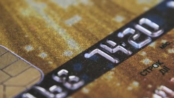Debit Card Rotates Close Golden Credit Card Chip Numbers Plastic — Vídeo de Stock