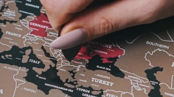 Female Hand Scratching Europe Countries Surface Scratch World Map Scratch — Stockvideo