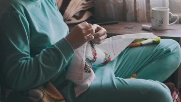 Young Woman Sews Manually Thread Needle Slow Motion Woman Casual — Vídeos de Stock