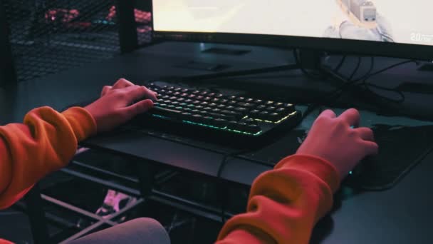 Teenage Boy Esports Club Sits Front Monitor Plays Shooter Game — Stock Video